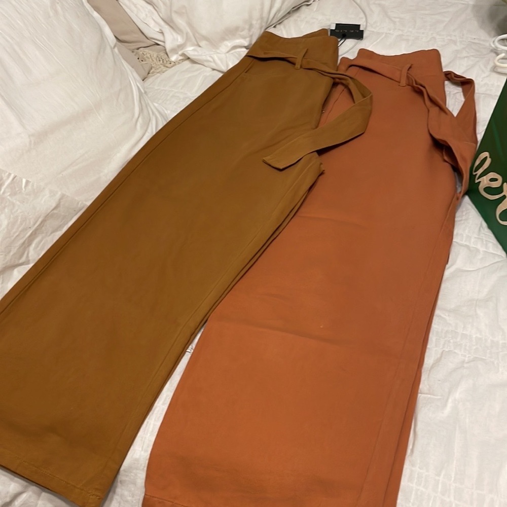 Brand New High Waisted cropped Pants with Belt. Tags still attached Size Small.
